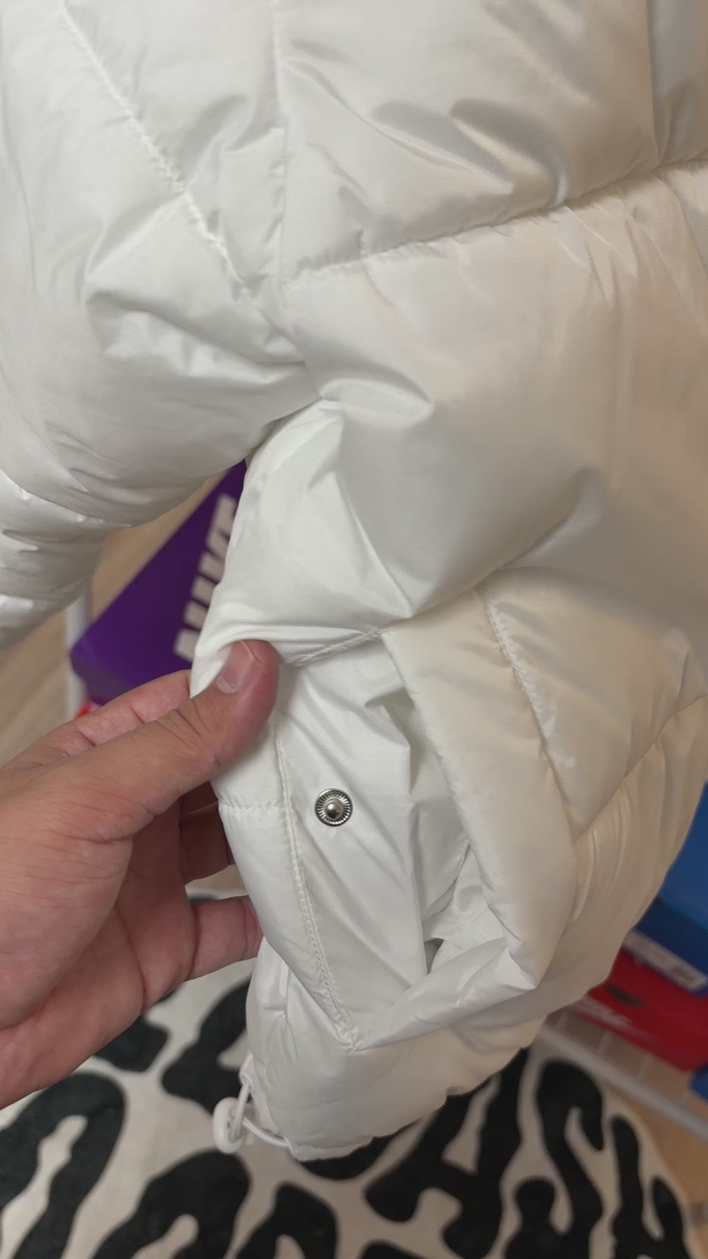 Off-white quilted jacket with a stand-up collar