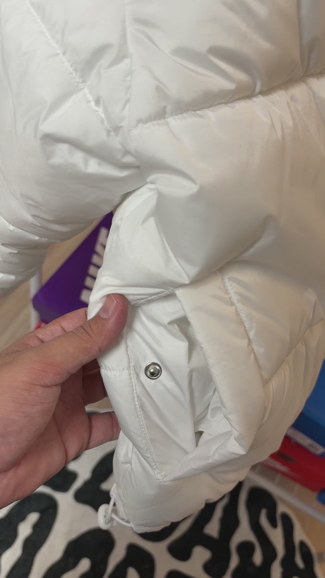 Off-white quilted jacket with a stand-up collar